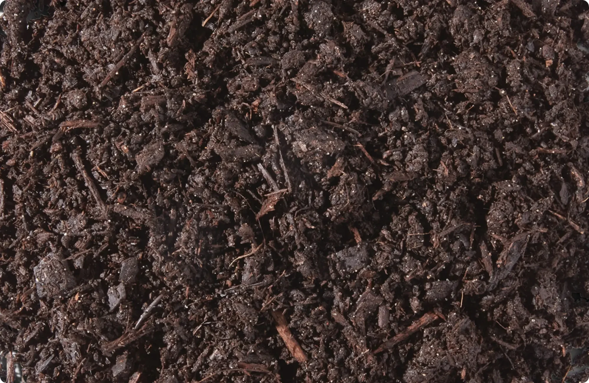 Close-up of Metro-Mix bark potting mix with dark organic bark pieces and soil for improved container drainage