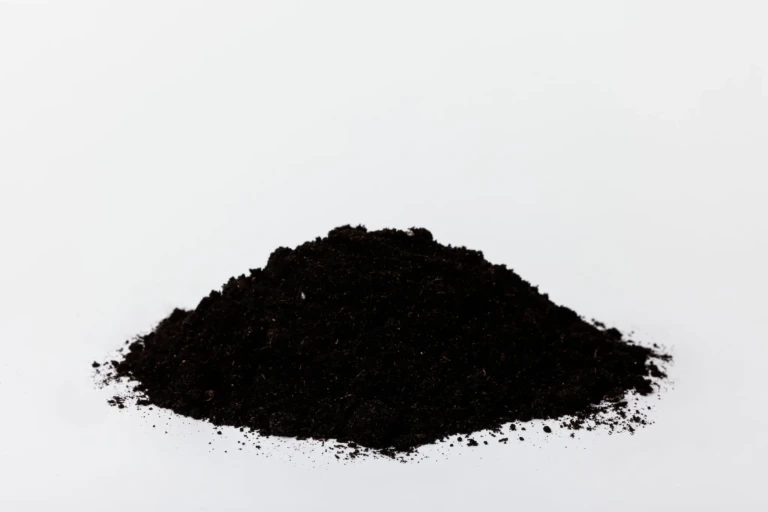 Black Gold NO Earthworm Castings Blend dark organic potting soil pile on white background for container gardening