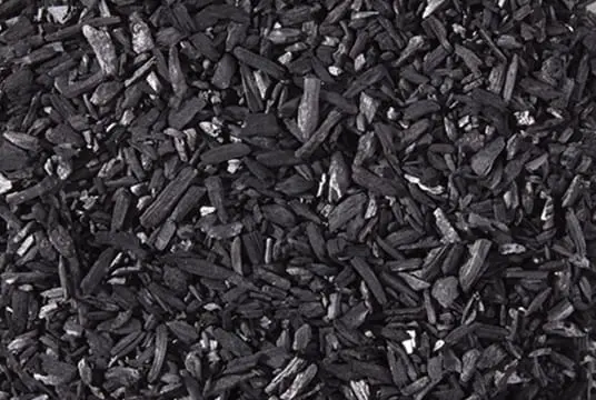 Close-up of black biochar wood granules for soil amendment and carbon sequestration in gardening and agriculture
