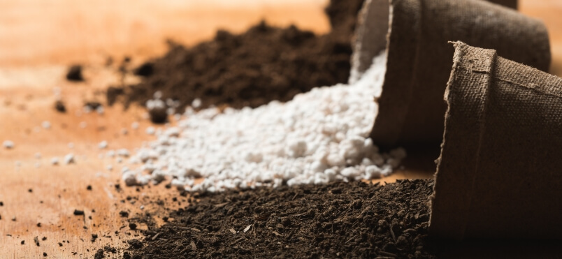 Soil and perlite spilling from plant pots